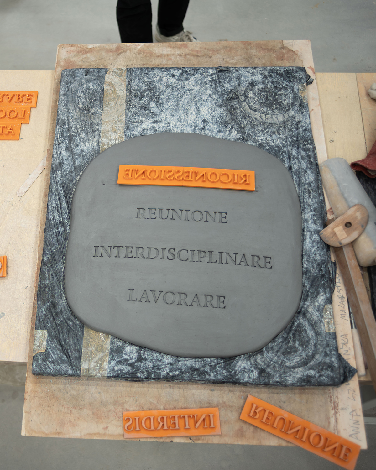 Embossing the manifesto into clay